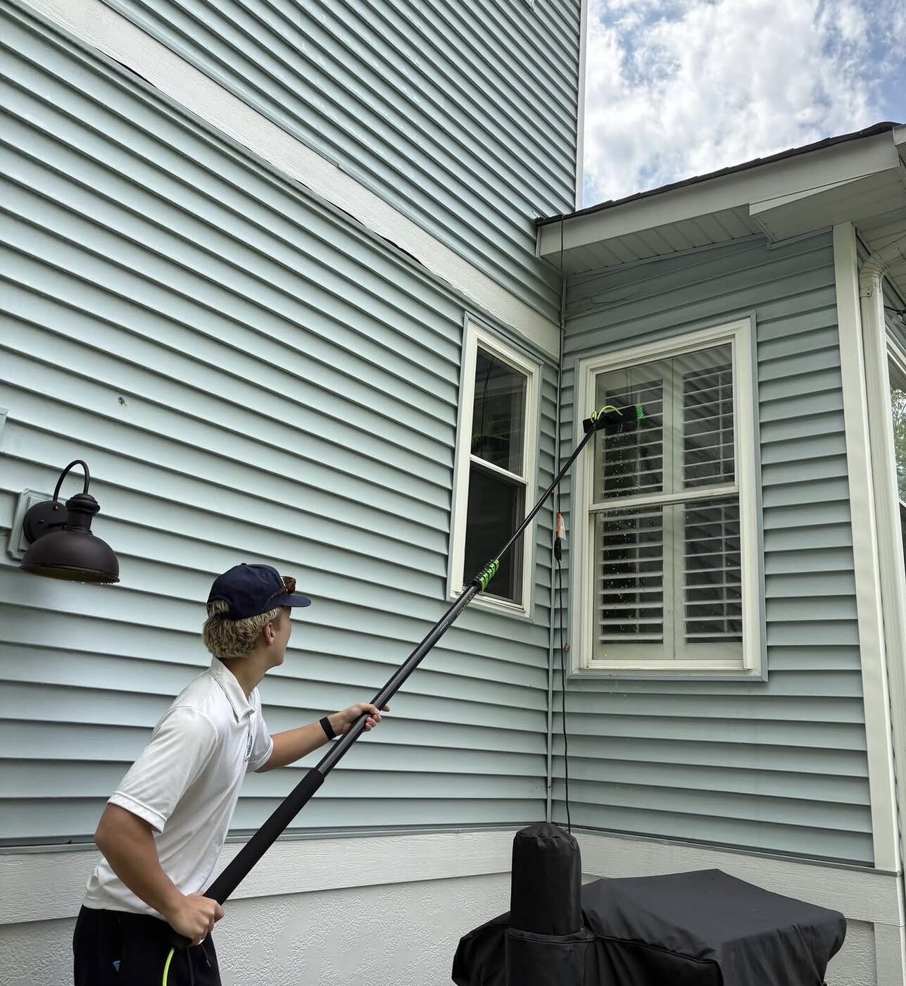 Reaching high windows from the ground with a pole