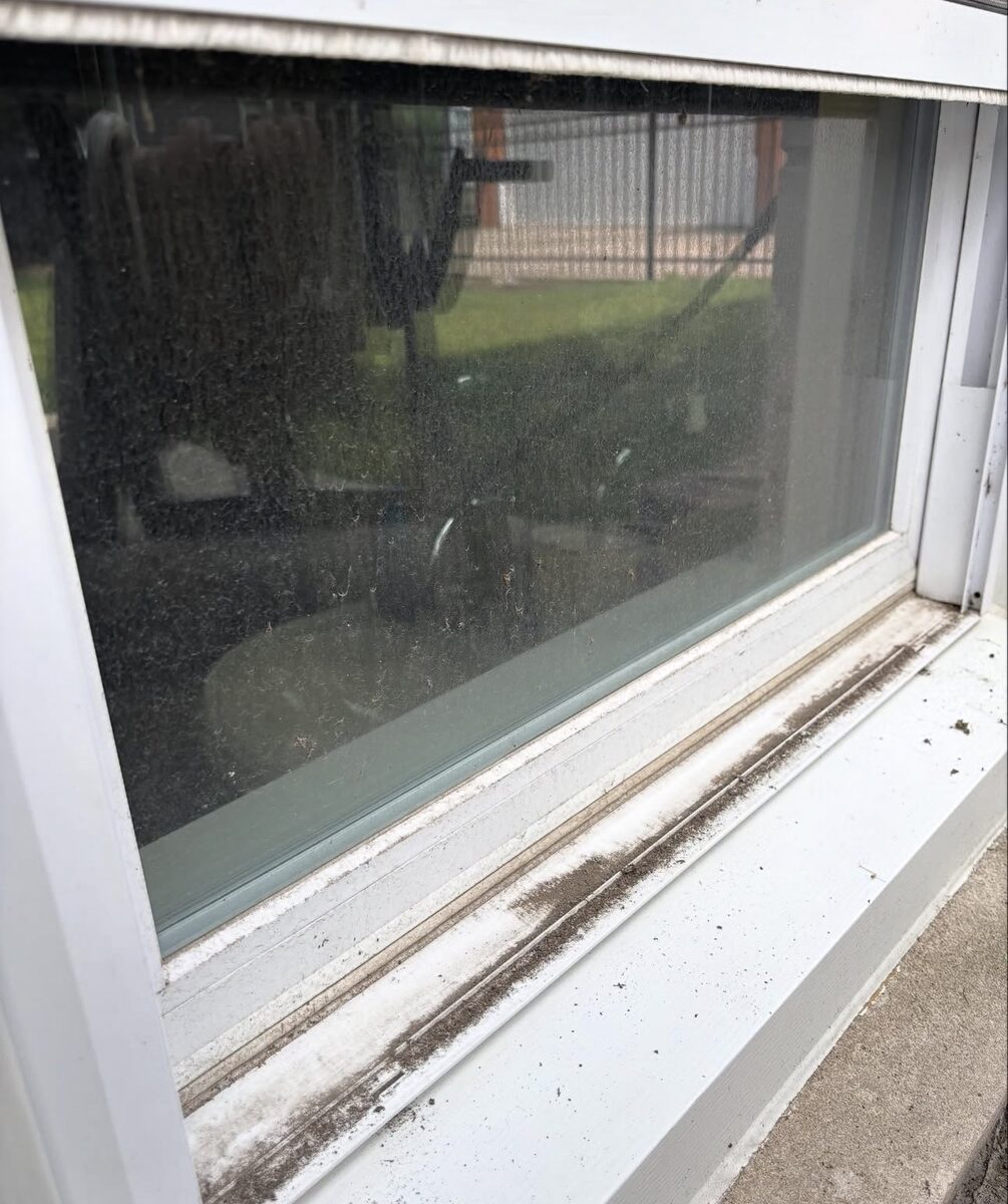 Window sill and track before cleaning