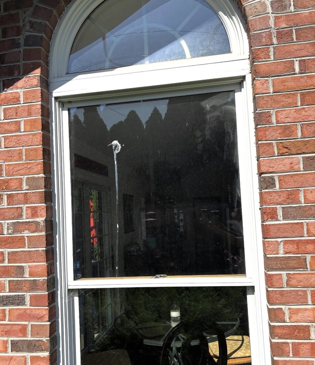 Arched feature window before cleaning