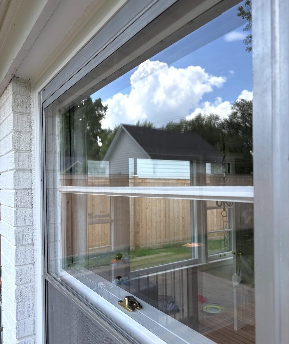 Double-hung window after cleaning, clear view of the sky